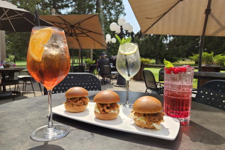 Burger sliders and drinks on a patio