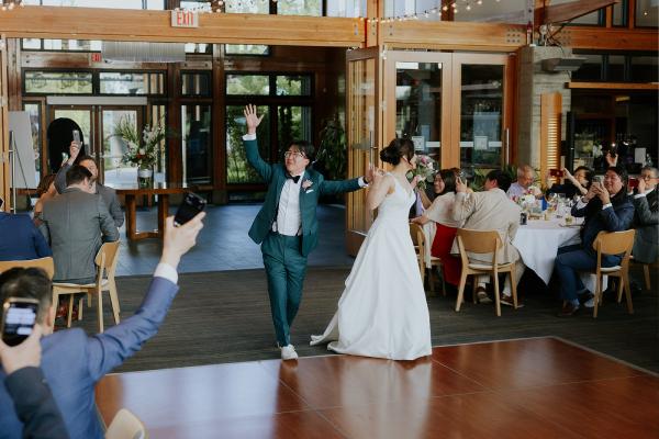 A couple enters the Riverway reception room